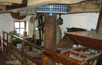 Inside the 12th century water powered Mill showing the grinding stones used to crush up the grain into flour