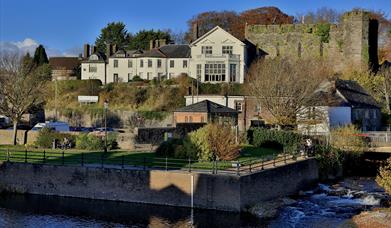 River Usk looking towards remains of Brecon Castle and Brecon Castle Hotel