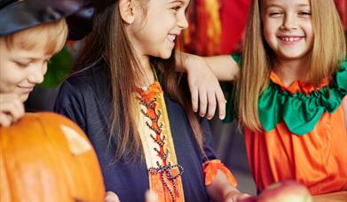 Children carving pumpkins