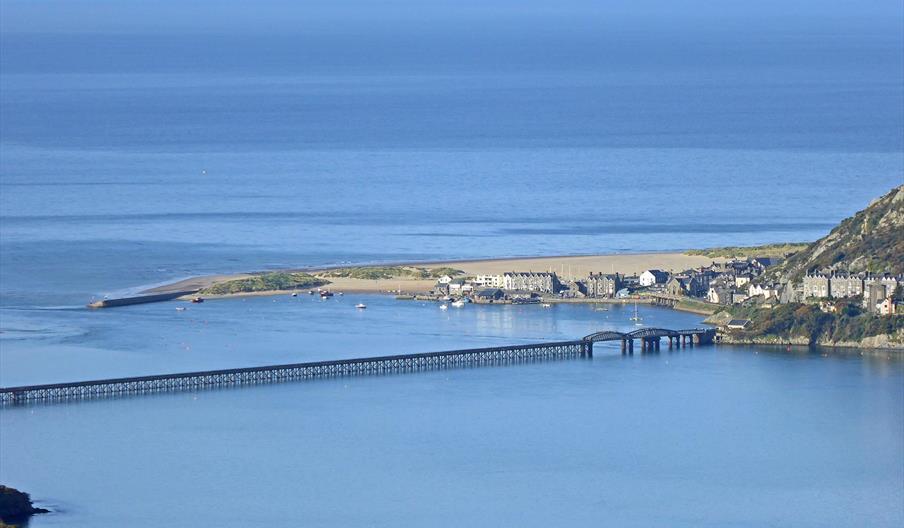 Barmouth in Southern Snowdonia is a great location for Mountain, Sand and Sea. Extensive sandy beach with attractions, water sports and boat trips.