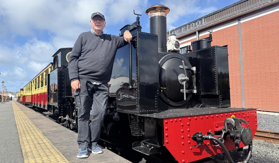 Music Producer and model rail enthusiastic Pete Waterman standing in front of Vale of Rheidol Railway's steam engine No. 8 'Llewelyn'