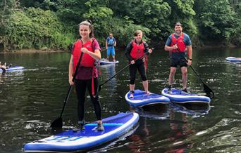 Stand-up paddleboarding on the River Wye in the Wye Valley Monmouthshire Wales for all, families, friends & team building days out.