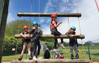 Young children on a climbing frame