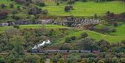 A steam train travels through the Brecon Beacons