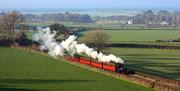 A steam train passes the cottages - and there is a small halt where visitors can join the ride