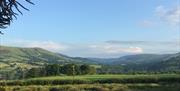 Set in 10 acres of rural pastureland, every room has impressive views of the surrounding Cambrian Mountains and rolling hills.