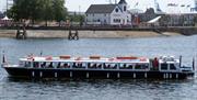 Cruising across Cardiff Bay past the Norwegian Church