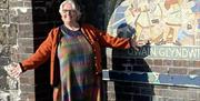 Alison in foreground, mosaic in background.