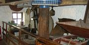 Inside the 12th century water powered Mill showing the grinding stones used to crush up the grain into flour