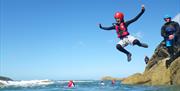 Family coasteering with Celtic Quest Coasteering in Pembrokeshire. Minimum age 8 years, share an unforgettable experience with your children exploring