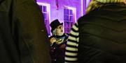 Alison in guided  ghost walk, presenting.