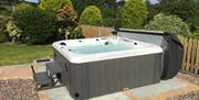 Relax and enjoy the surroundings in our new Hot Tub with 3 jets, waterfall LED lighting and Bluetooth audio!