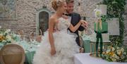 Couple cutting the cake in the Atrium