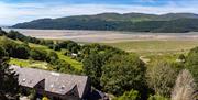 External view of cottages form above, with views of the estuary.