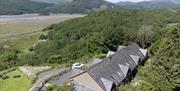 External view of cottages form above, with views of the estuary.