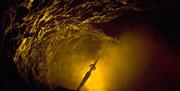 The sword in the stone at King Arthur's Labyrinth in Mid Wales.