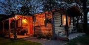 Exterior view of a cabin in Wales. Dog friendly accommodation with hot tub and private garden.
