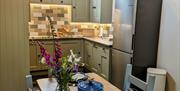 View of dining area into kitchen