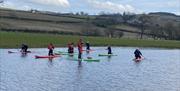 Paddleboarding at Meadow Springs Trefeglwys