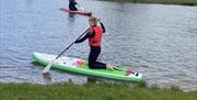 Paddleboarding at Meadow Springs Trefeglwys