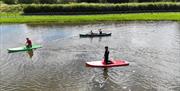 Paddleboarding at Meadow Springs Trefeglwys