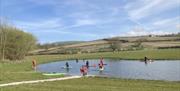 Paddleboarding at Meadow Springs Trefeglwys