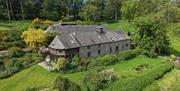 Exterior of Clyn with view of the grounds.