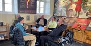 Strata Florida Visitor Centre with visitors enjoying a cup of tea and coffee