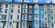 The seafront flat is on the first floor of the anthracite building
