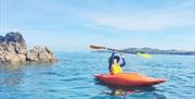 family sea kayaking