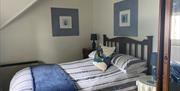 Llonydd Cottage bedroom at Rola Cottages