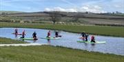 Paddleboarding at Meadow Springs Trefeglwys