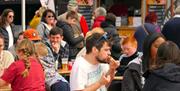 Hungry residents and holiday makers tucking into delicious street food