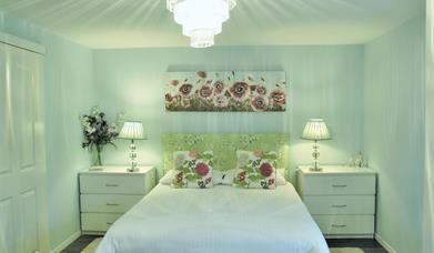 Romantic bedroom with a truly comfortable king bed and pristine bedding