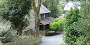 The Granary self catering cottage is surrounded by gardens and trees.